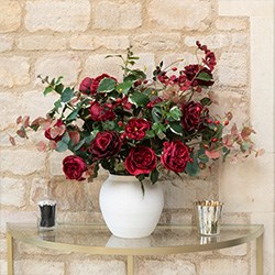 festive flower arrangement in glass vase